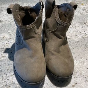 Tan booties with studs on sides.